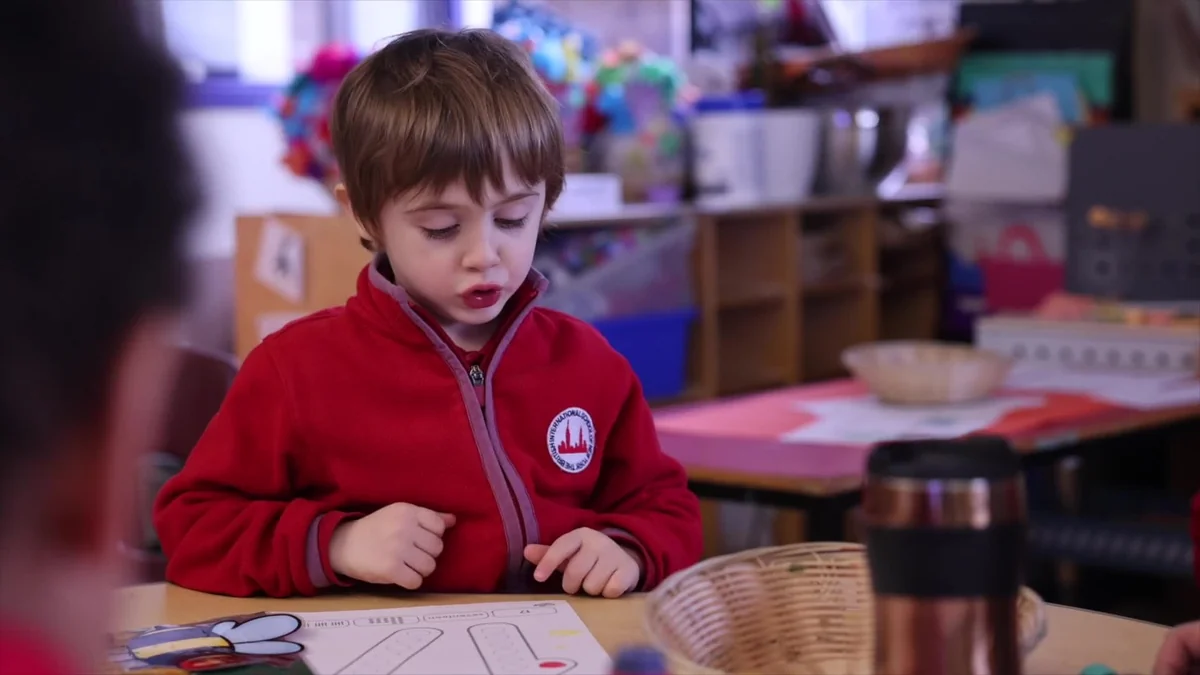 A BISNY Early Years child concentrating in class